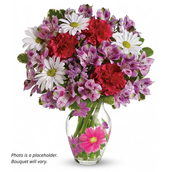 Bouquet of colorful flowers in vase.